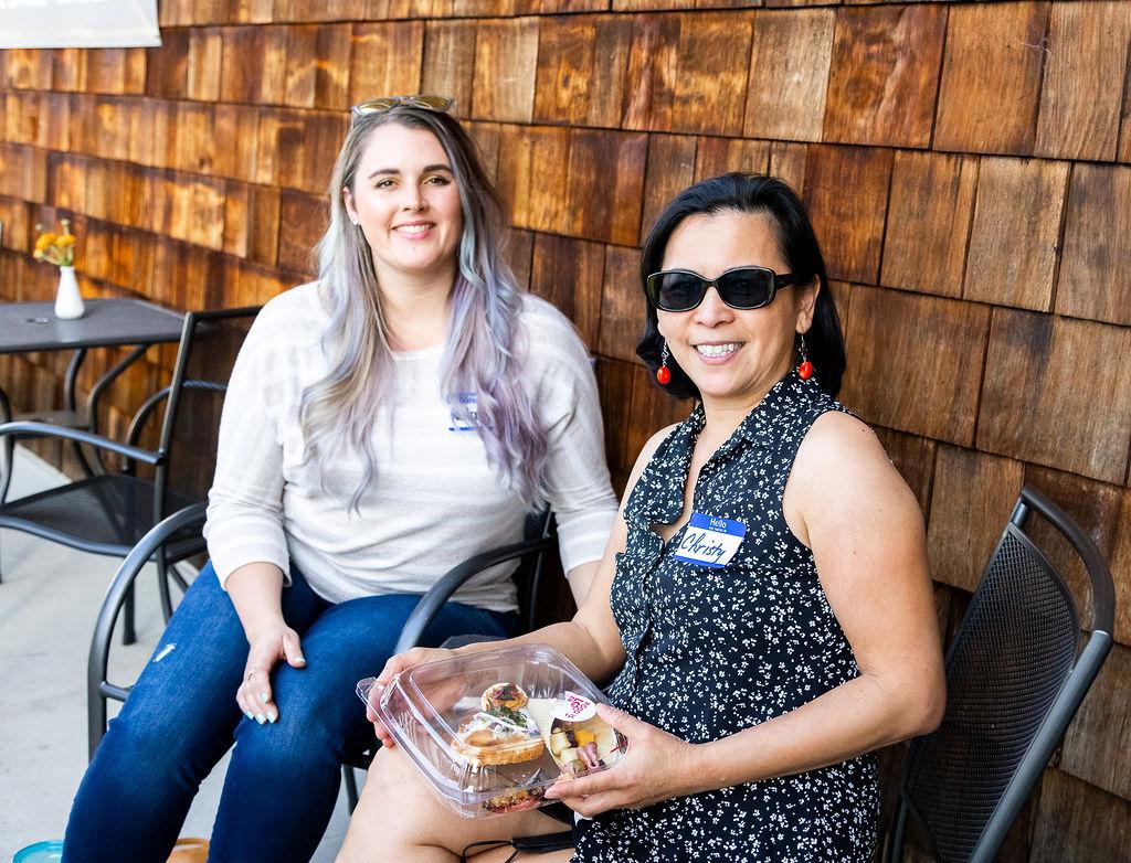 Two women at outdoor networking event with name tags at Granite City Workspaces