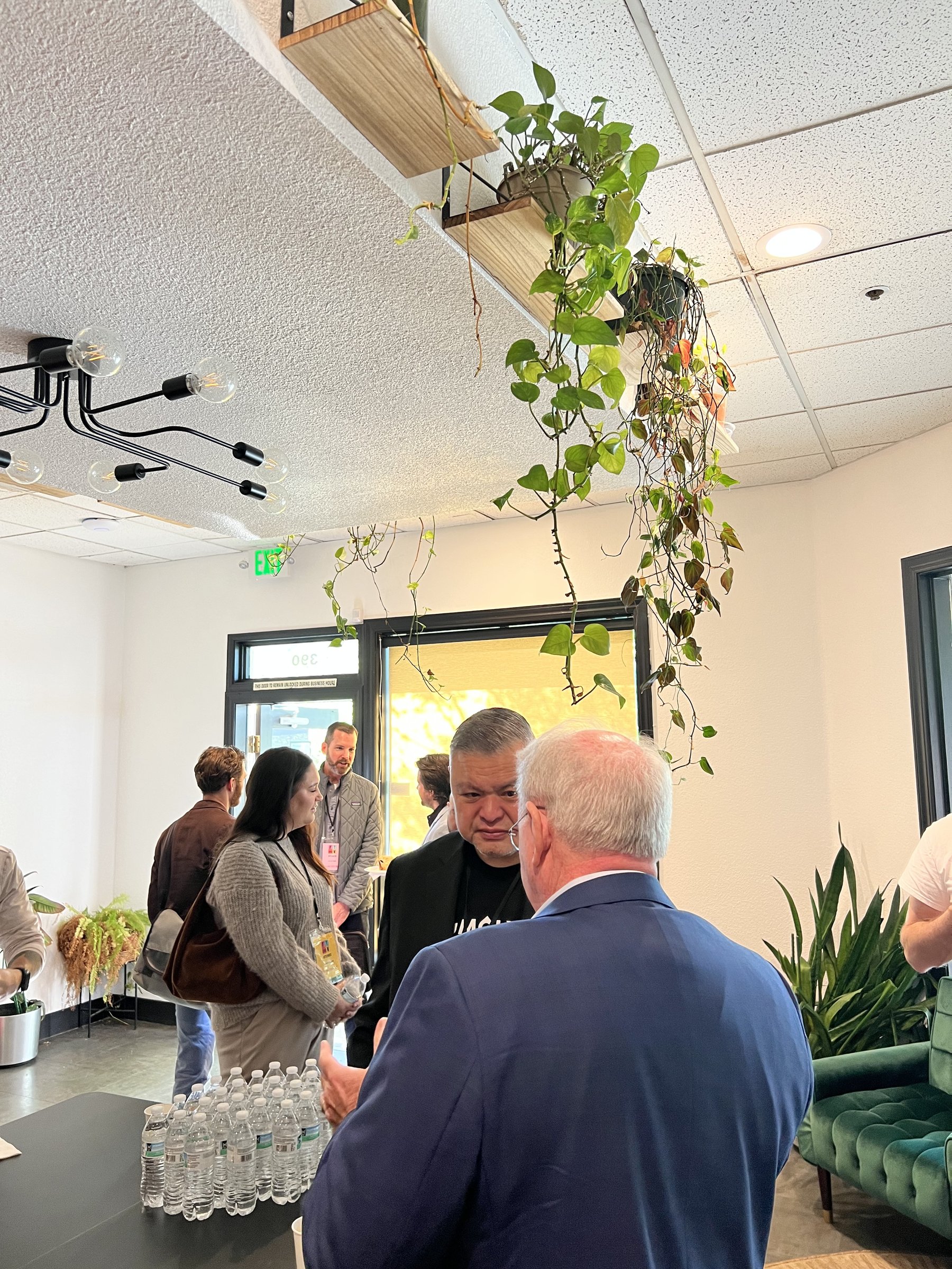 Event signage and a crowd gathered in the Commons at Granite City Workspaces in Folsom