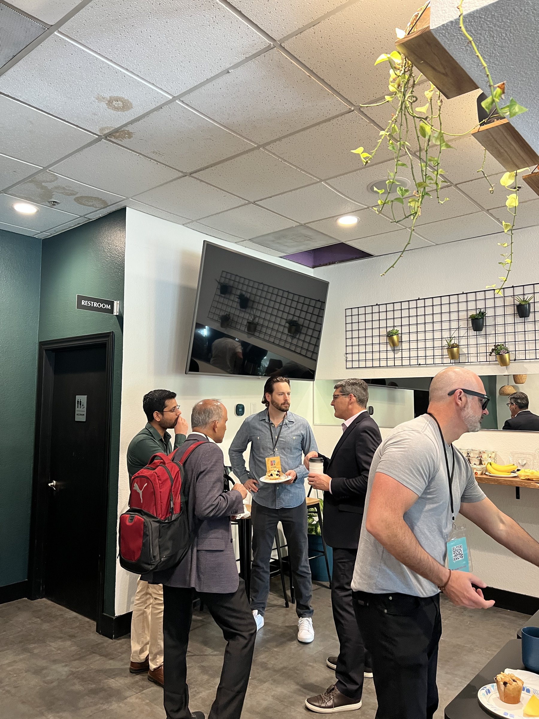 Guests mingling during an event in the Nook at Granite City Workspaces in Folsom